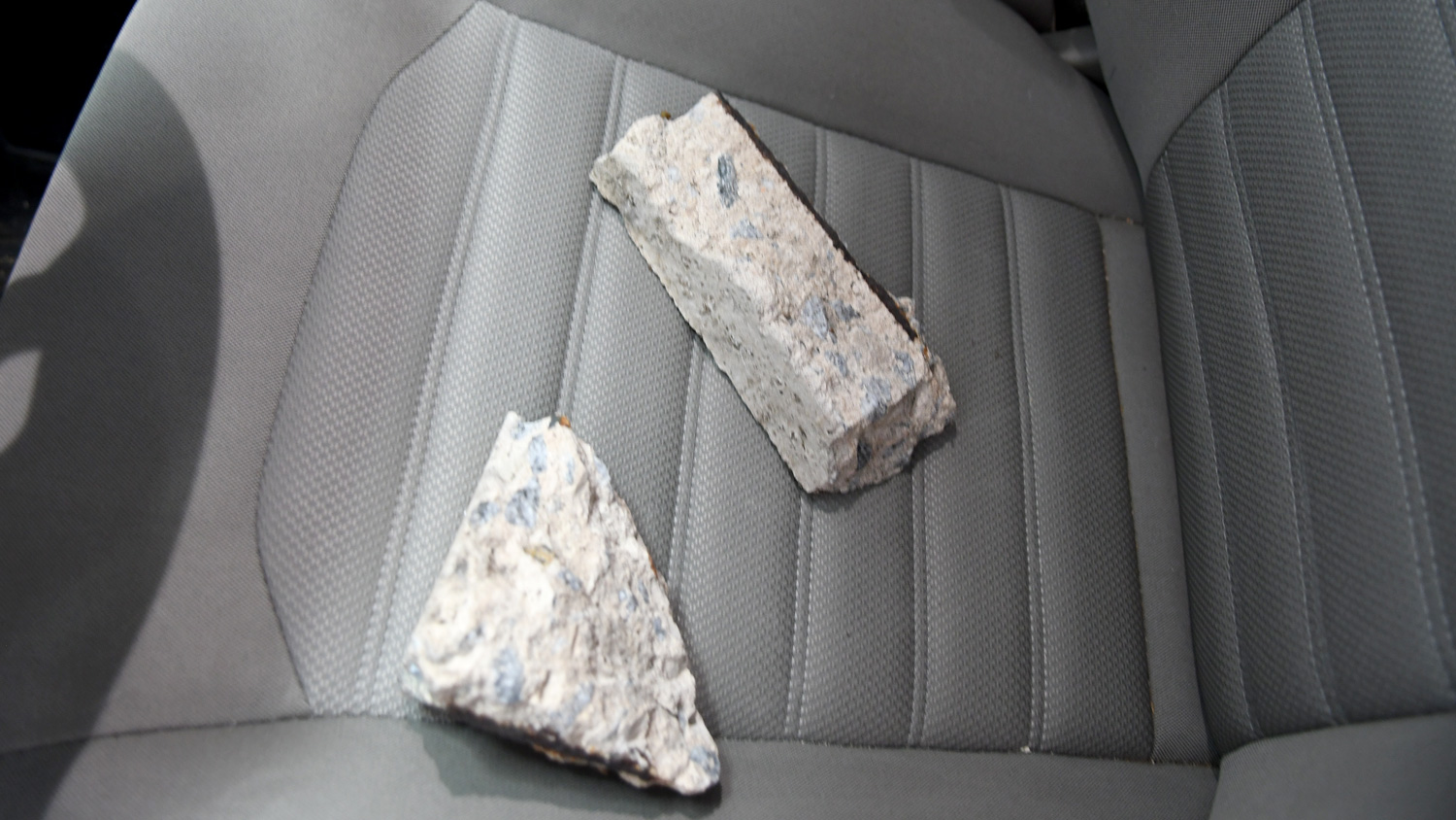 Cushion rocks sitting on the driver's seat in a testing vehicle.