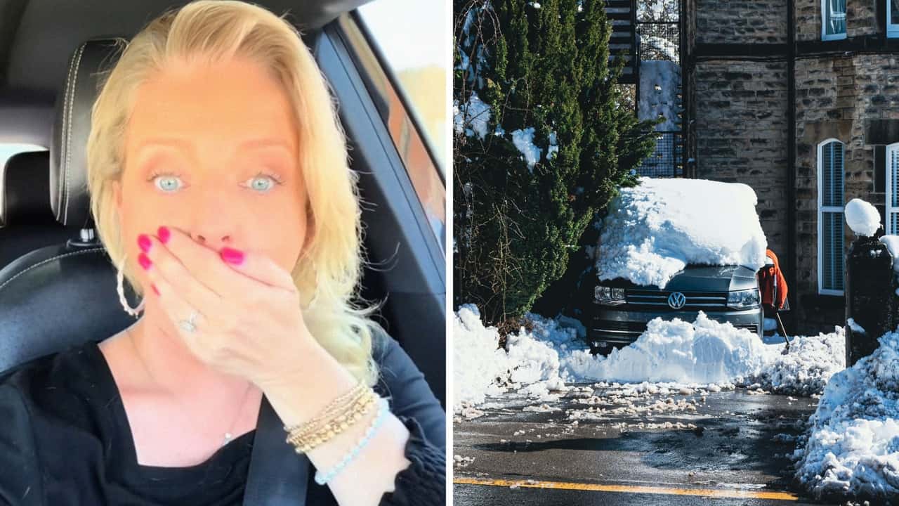 Texas Volkswagen driver tries to get in car during winter storm. Then she realizes her door handle broke off due to it