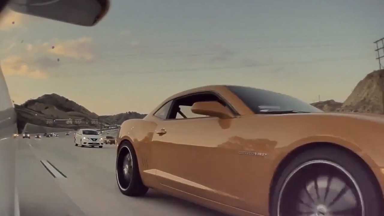 See This Camaro Driver Throw A Bunch Of Coins In a Tesla Model 3