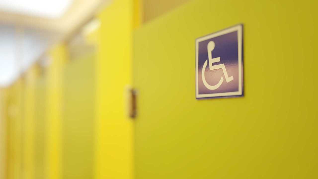 Toilet doors with disability sign