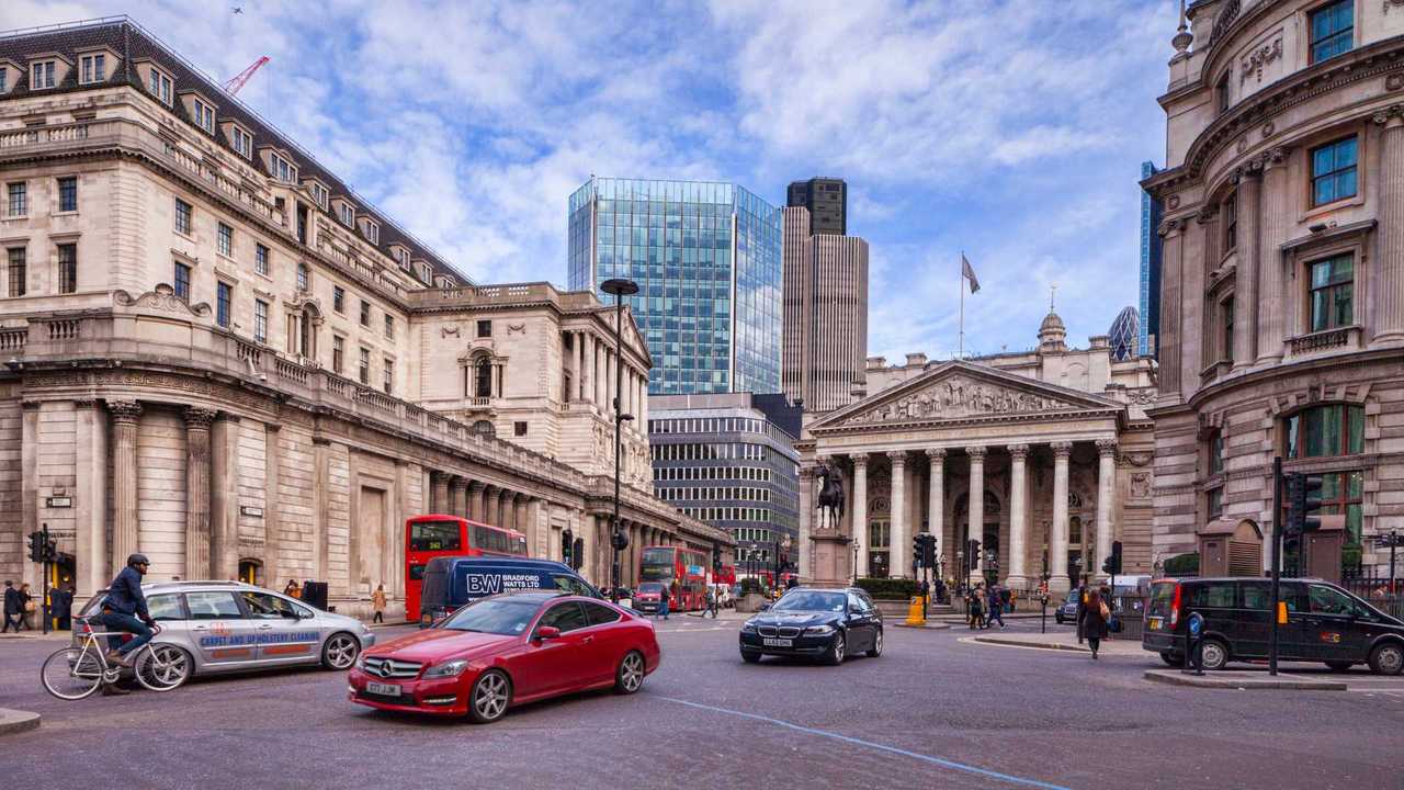 Traffic on Threadneedle Street with Bank of England and Royal Exchange in London