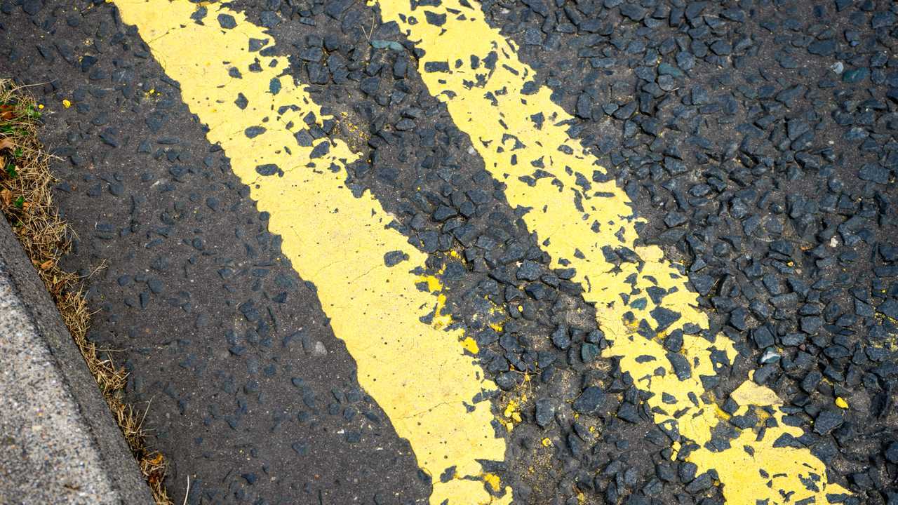 Yellow lines on a tarmac road