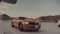 See This Camaro Driver Throw A Bunch Of Coins In a Tesla Model 3