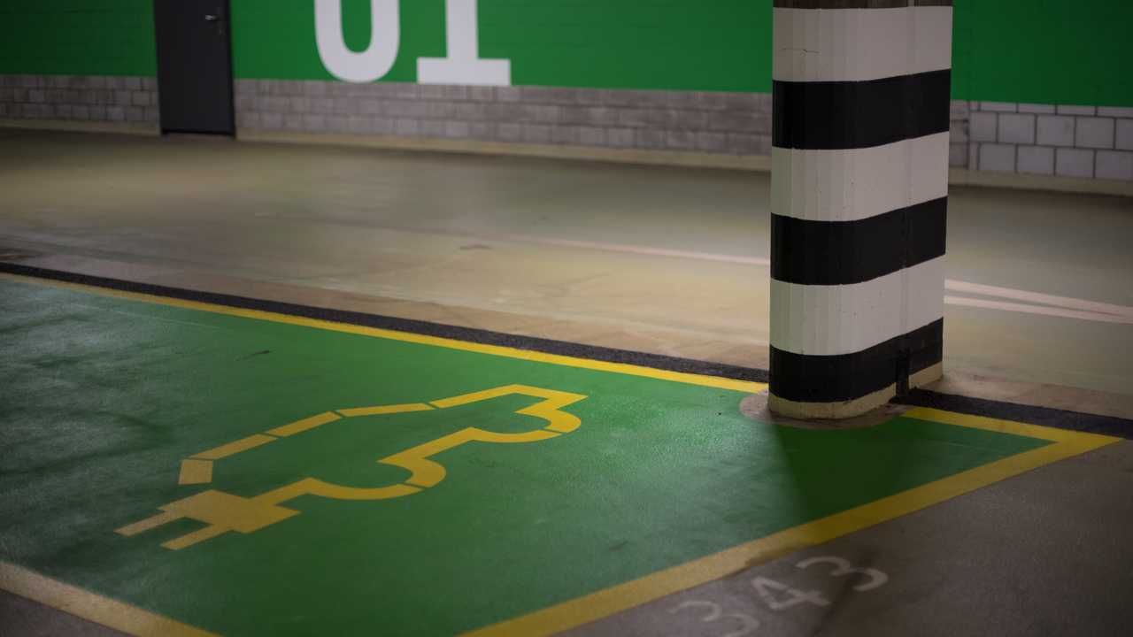 Electric car parking place in public garage