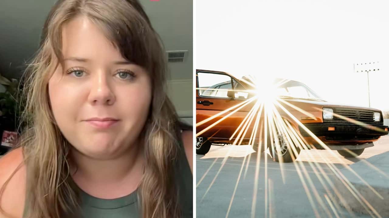 Woman parks her [TK CAR BRAND] in the hot sun. Then she pops open her umbrella
