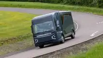 REE Automotive P7-B electric Class 3 delivery truck exterior front three-quarter view driving