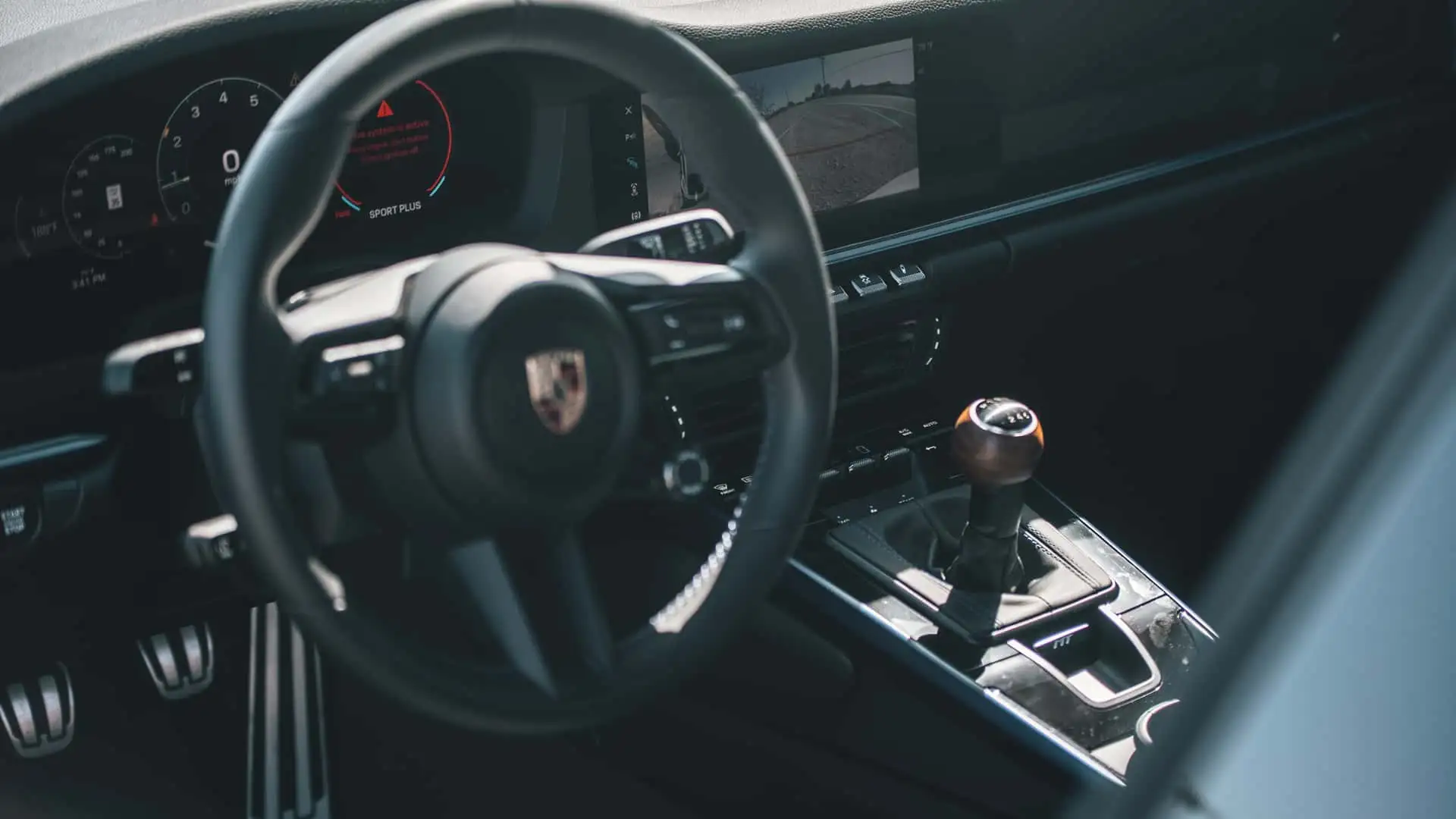 https://cdn.motor1.com/images/mgl/2N4mrx/s1/2026-porsche-911-carrera-t-review.webp