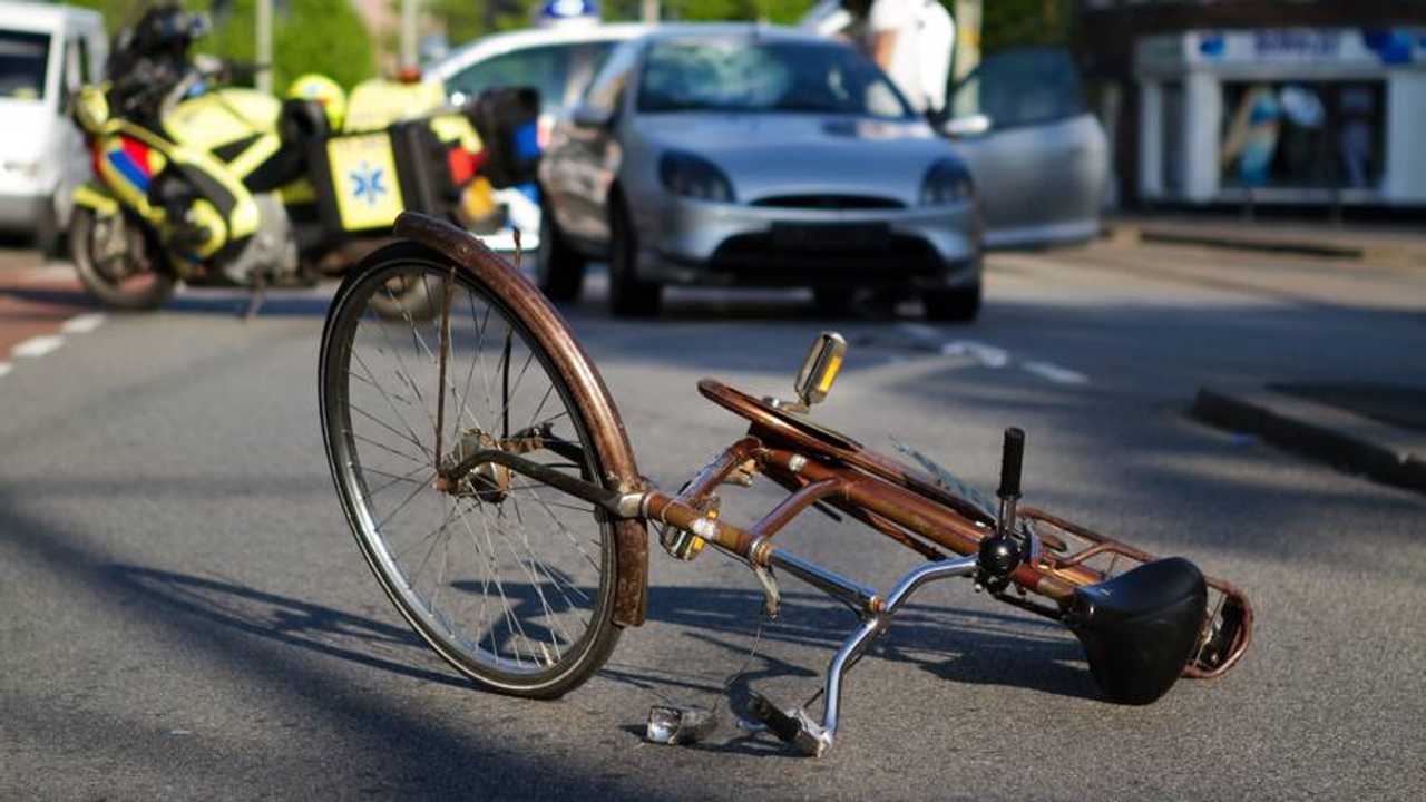 Cyclist hit by car with paramedics and police on scene