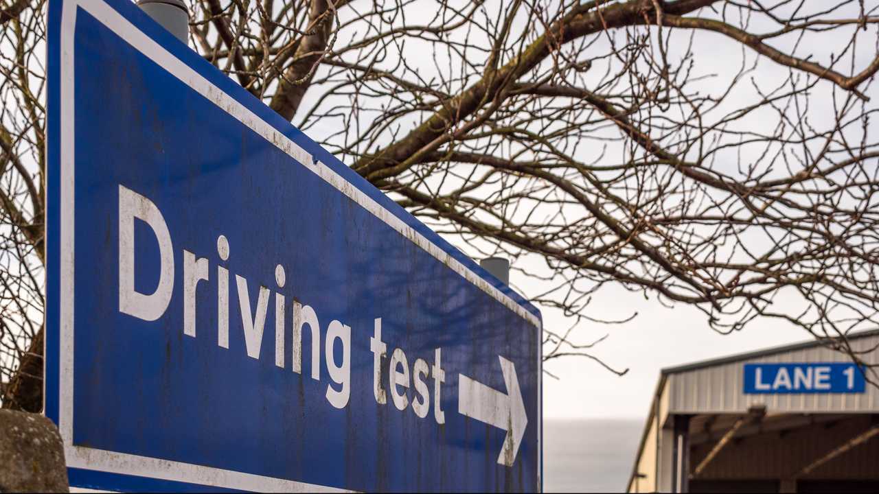 Driving test directional sign post in England