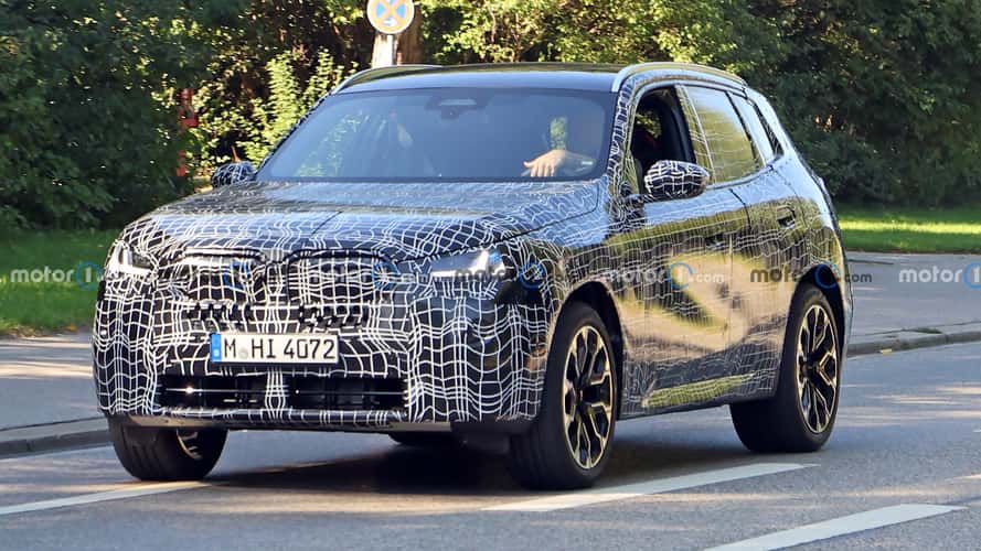 2025 BMW X3 spied showing production lights through camo