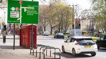 Ultra Low Emissions Zone sign with Nissan Leaf