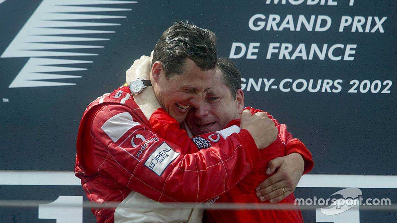 Michael Schumacher celebrates with Jean Todt