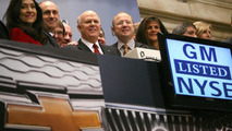 General Motors CEO Dan Akerson (center) rings the opening bell (horn) at the New York Stock Exchange, marking a historic milestone as GM's common stock begins trading publicly again Thursday, November 18, 2010 in New York. GM and NYSE executives surround