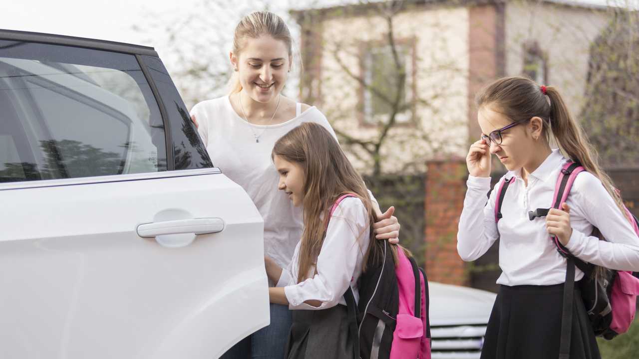 Schoolgirls getting a ride to school