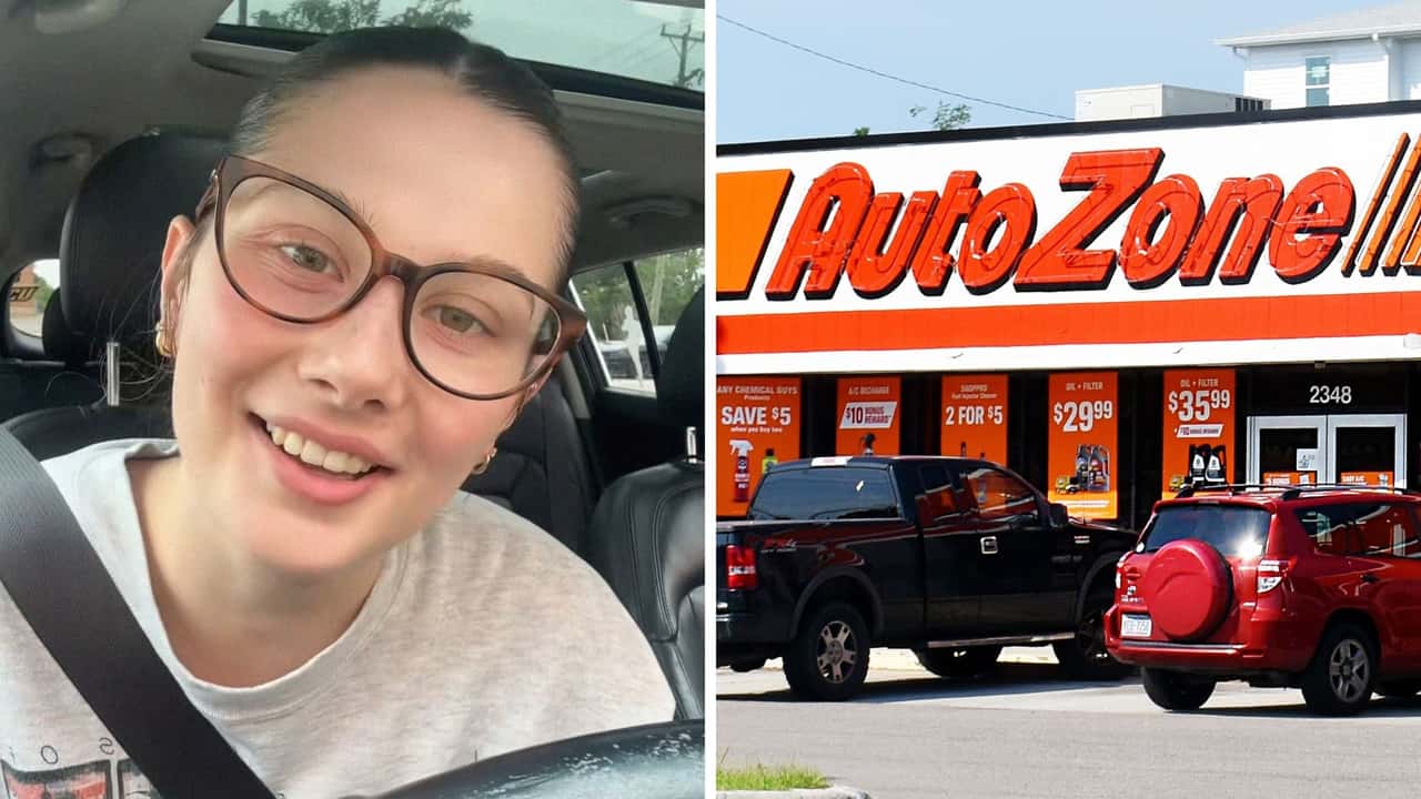 Woman buys STP oil at AutoZone. 