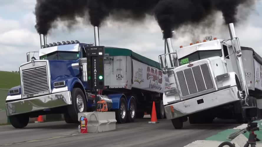 See loaded semi trucks twist with torque in uphill drag racing contest