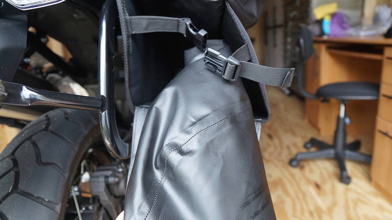Notice the opening is to the rear for easy access. Both the bag and the opening have buckle closures.