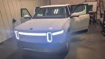 Glacier White Rivian R1T with tinted windows and taillights
