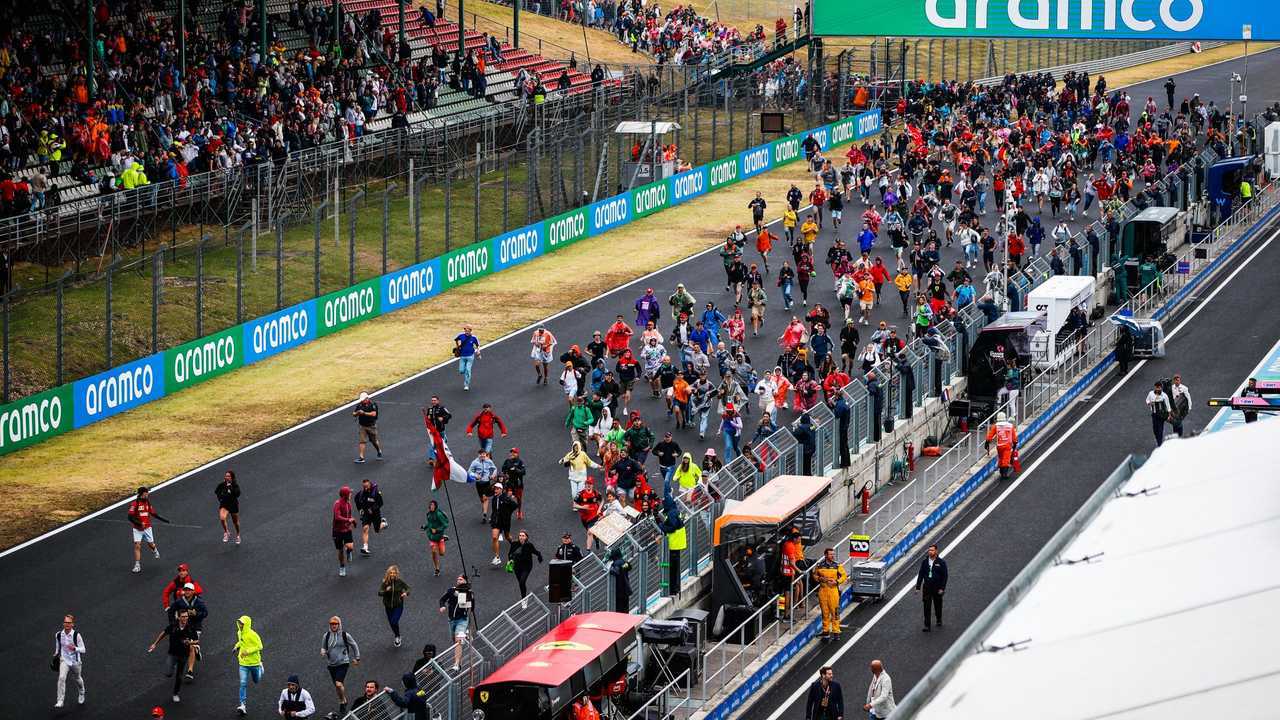 Fans invade the circuit for the podium ceremony at the end of the race