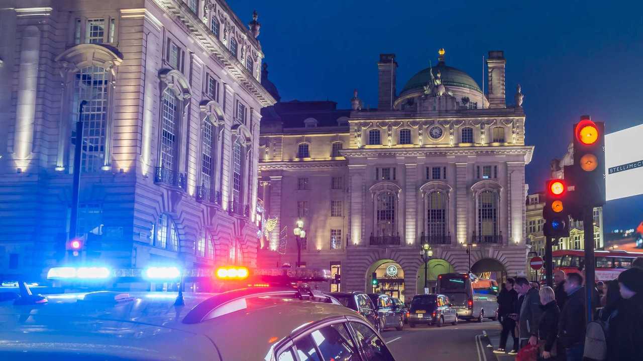 Police car lights near the London train station