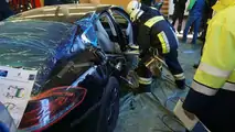Porsche Panamera being cut apart from the fire brigade