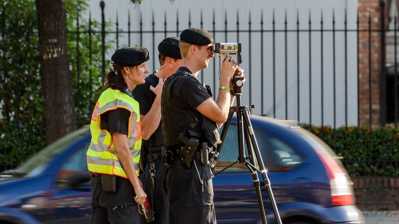 German speed control police with radar gun in Berlin