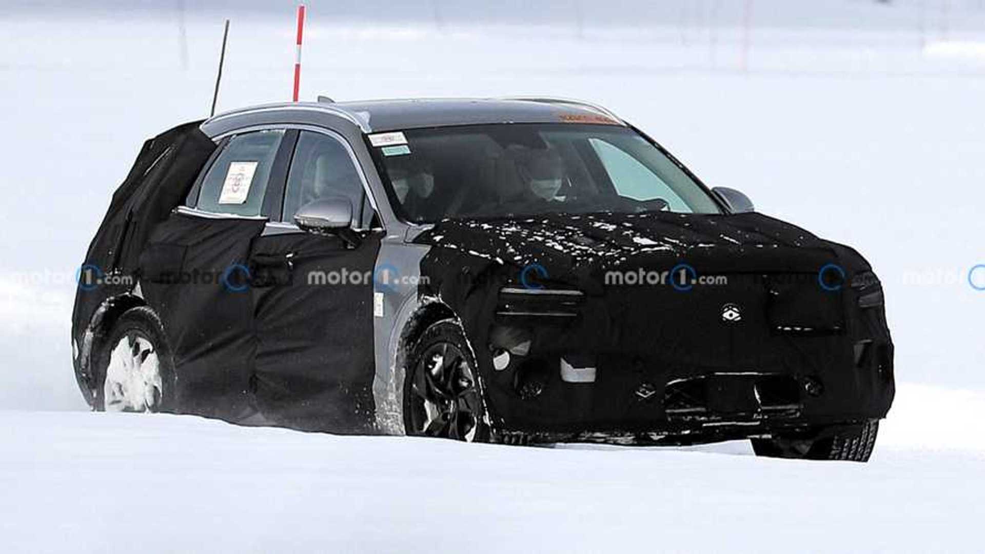Genesis GV70e electric SUV spied undergoing snow tests