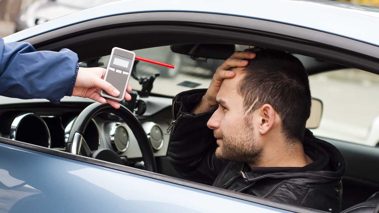 Worried man before taking breathalyser test for alcohol