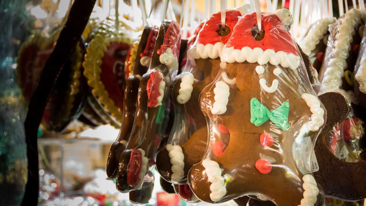 Plastic wrapped gingerbread men hanging in Christmas market