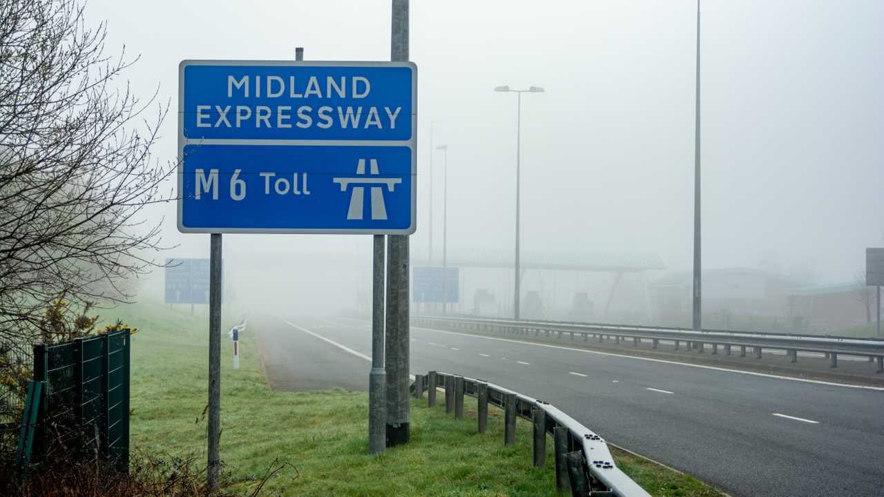 M6 Toll entry slip road on a foggy morning in Cannock Staffordshire UK
