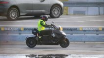 BMW Definition CE-04 Spy Shots - Right Side Rain Riding Around Puddle