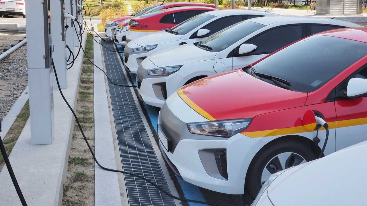 Electric car fleet at charging stations