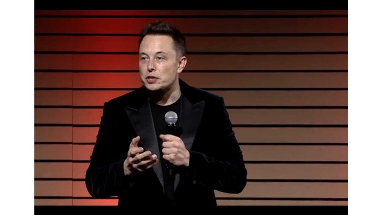 Musk on stage at the Model S batter swap demo