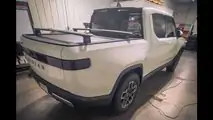 Glacier White Rivian R1T with tinted windows and taillights