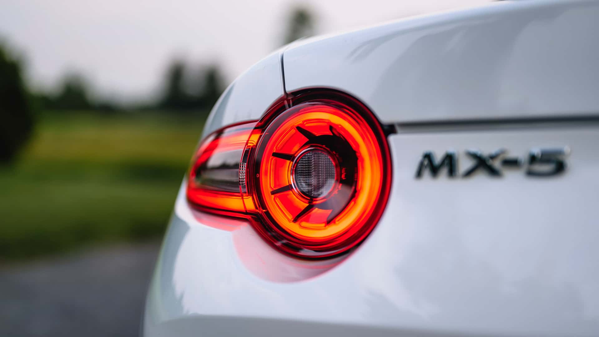 https://cdn.motor1.com/images/mgl/AkQ7KP/s1/2024-mazda-mx-5-miata-grand-touring-review.jpg
