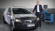 Opel Group CEO Dr. Karl-Thomas Neumann presents a heavily camouflaged all-new next generation Astra prototype