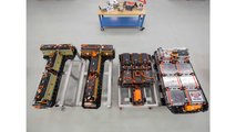 A Chevrolet Bolt EV battery pack, far right, is compared to battery packs from, left to right, a first generation Volt, a second generation Volt, and a Spark EV in General Motors Global Battery Systems Laboratory at the GM Technical Center in Warren, Michigan, Tuesday, April 5, 2016. (Photo by Jeffrey Sauger for General Motors)