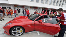 Sebastian Vettel with the Ferrari F12berlinetta