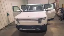 Glacier White Rivian R1T with tinted windows and taillights
