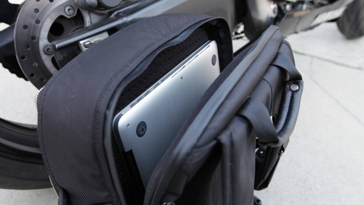 Laptop pouch is fleece-lined and well padded, making us feel secure about transporting a MacBook.