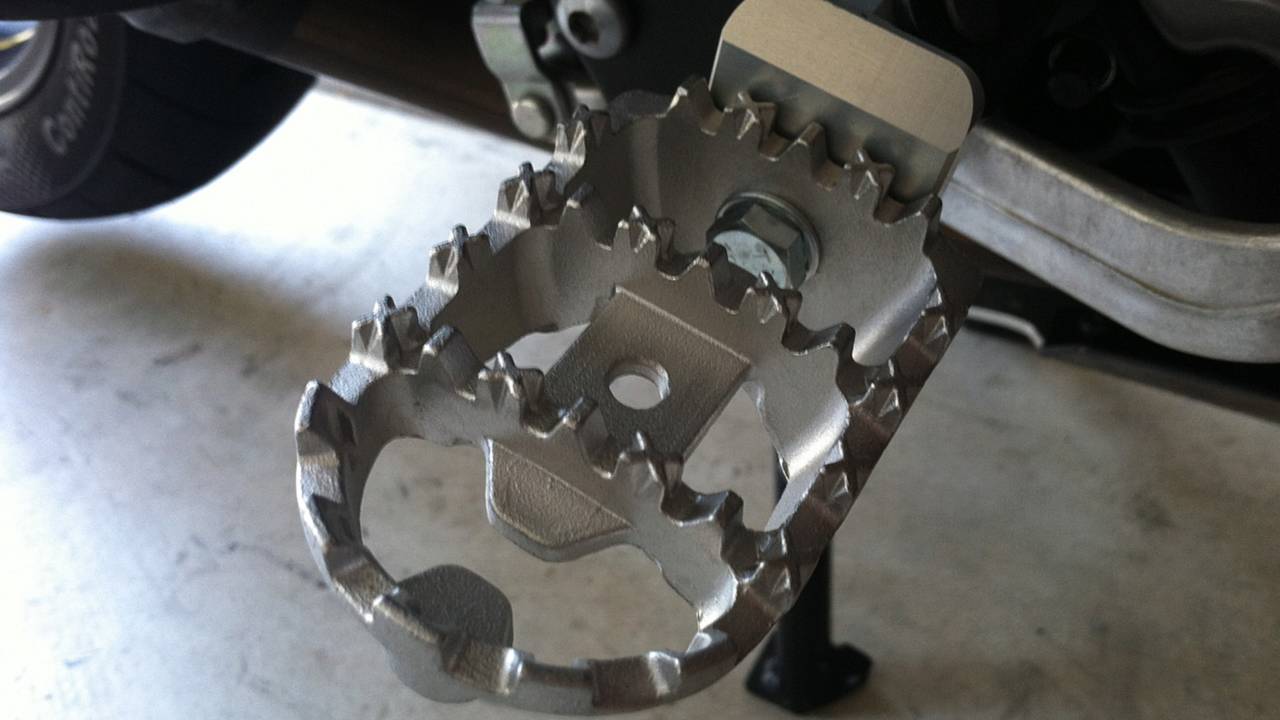 SW-Motech pegs are considerably wider, increasing both purchase and comfort.