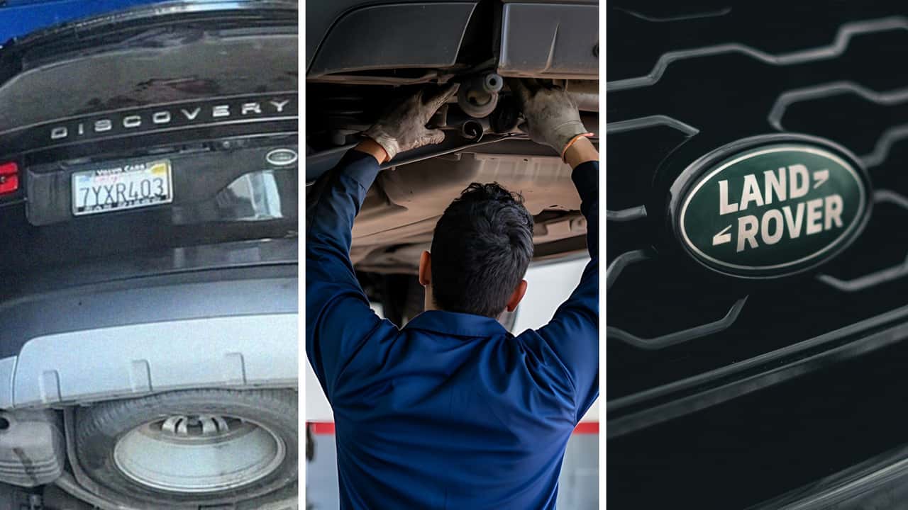 Mechanics work on a Land Rover Discovery