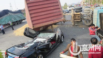 Audi S5 flattened by container