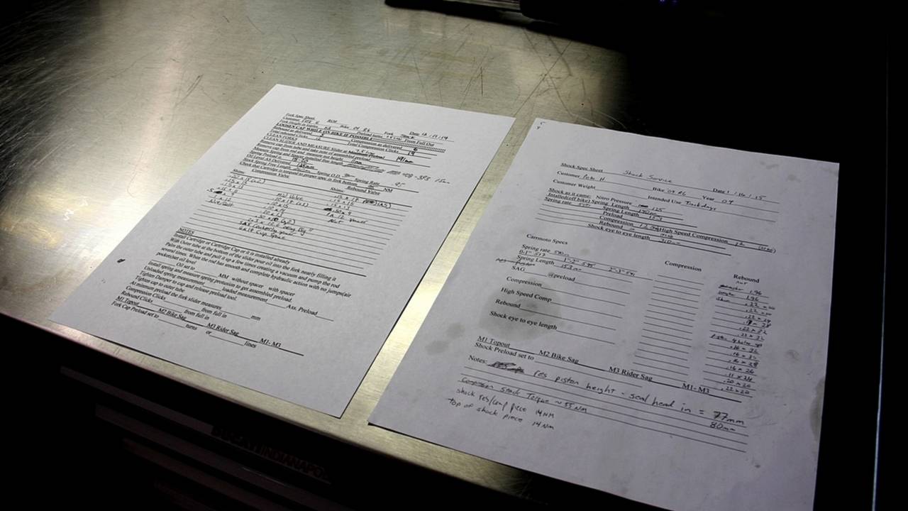Matt takes copious notes on every piece of suspension he services.