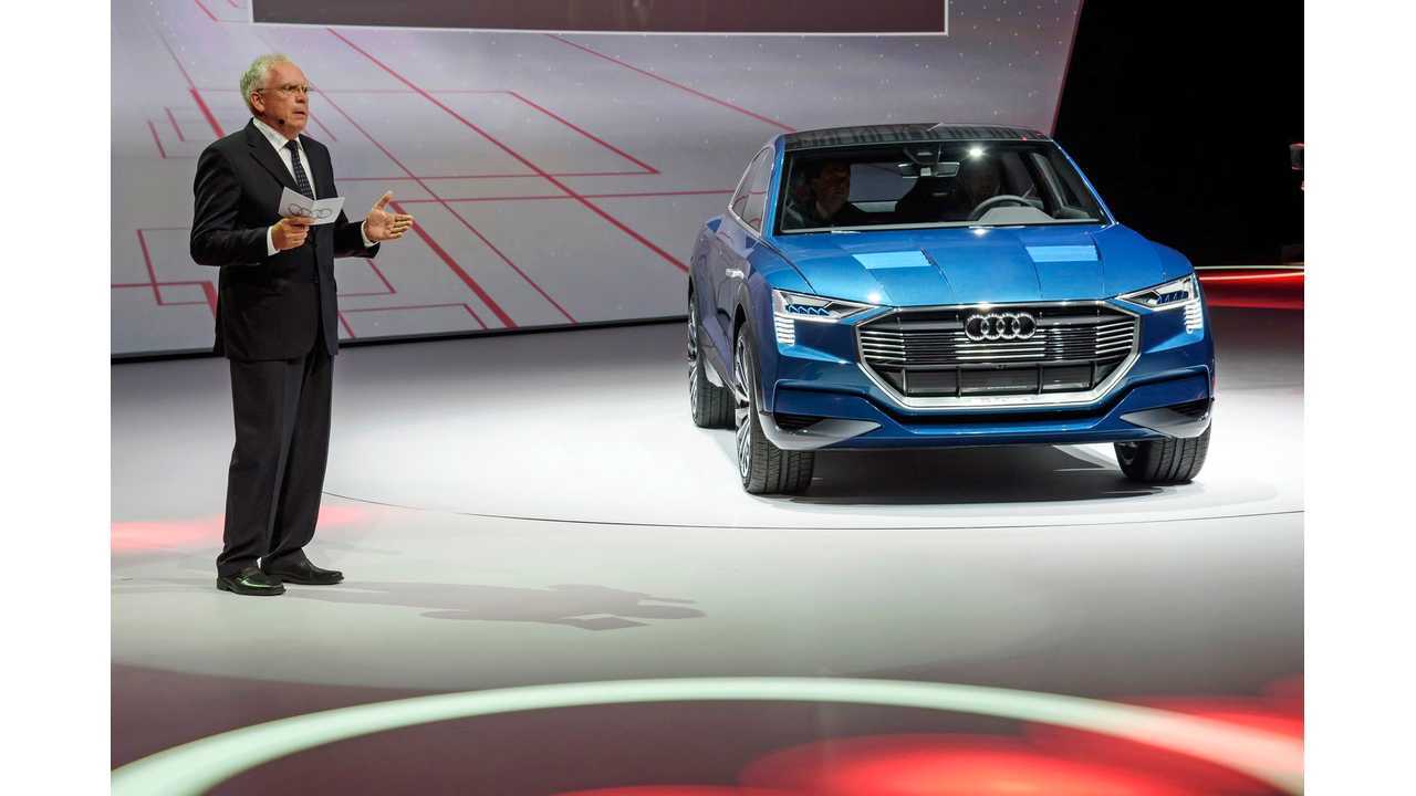 Prof. Dr. Ulrich Hackenberg, Member of the Board of Management of AUDI AG, Technical Development, beside the concept car Audi e-tron quattro at the Volkswagen Group Night (IAA) in Frankfurt.