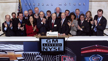 General Motors CEO Dan Akerson (center) rings the opening bell (horn) at the New York Stock Exchange, marking a historic milestone as GM's common stock begins trading publicly again Thursday, November 18, 2010 in New York. GM and NYSE executives surround