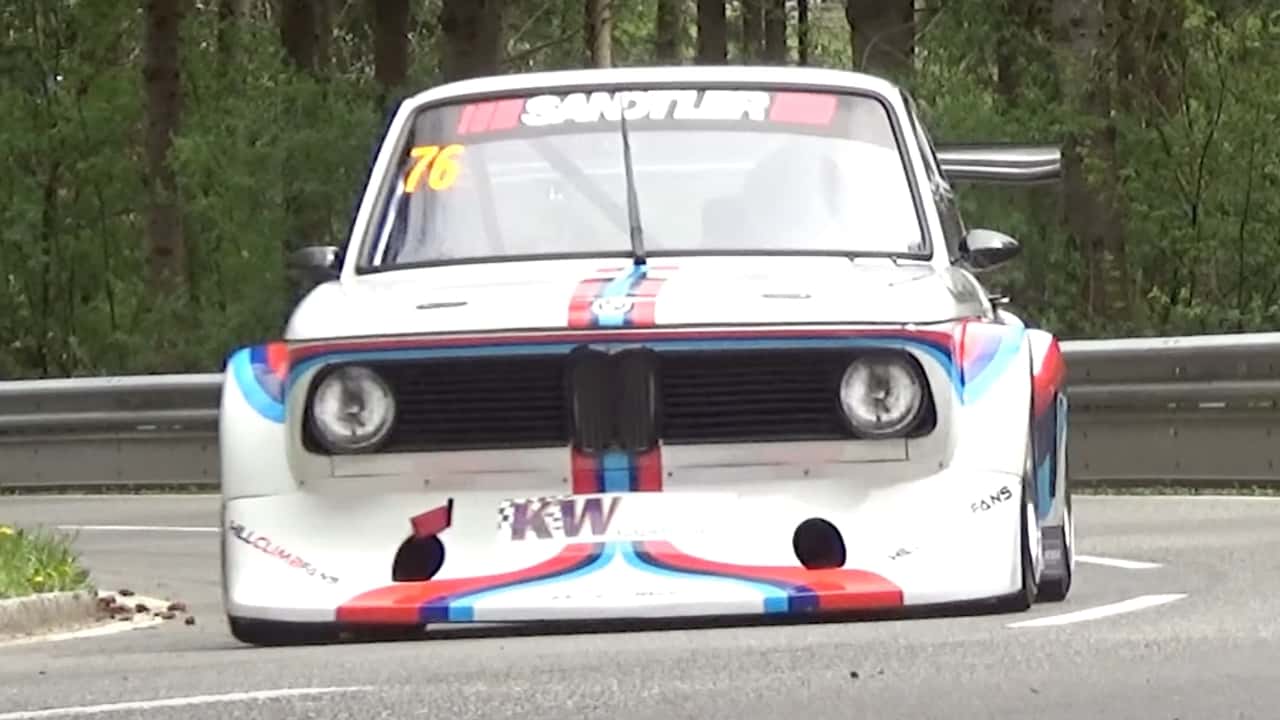 bmw 2002 hillclimb race car going through a corner