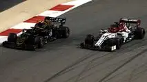 Kevin Magnussen, Haas F1 Team VF-19, battles with Kimi Raikkonen, Alfa Romeo Racing C38