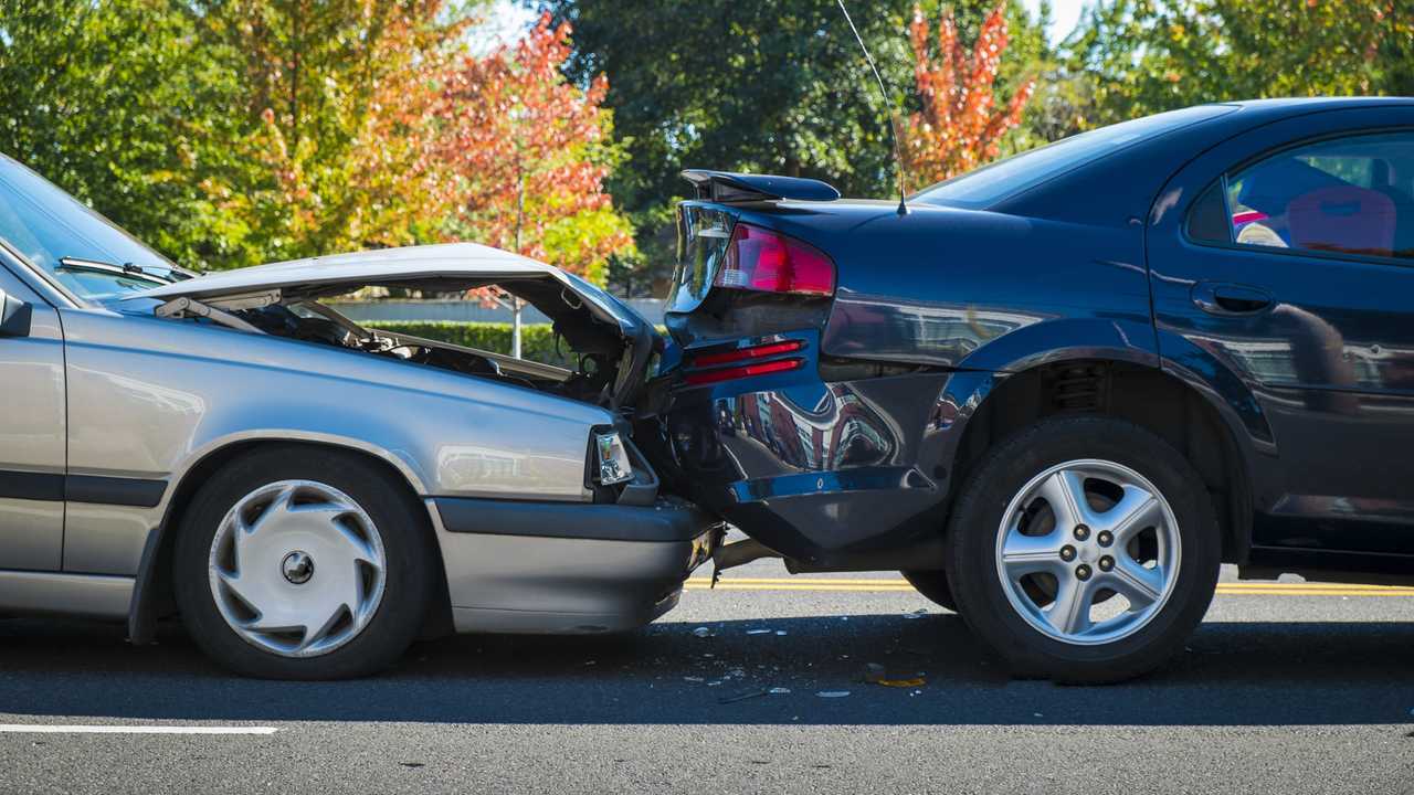 Auto accident involving two cars on a city street