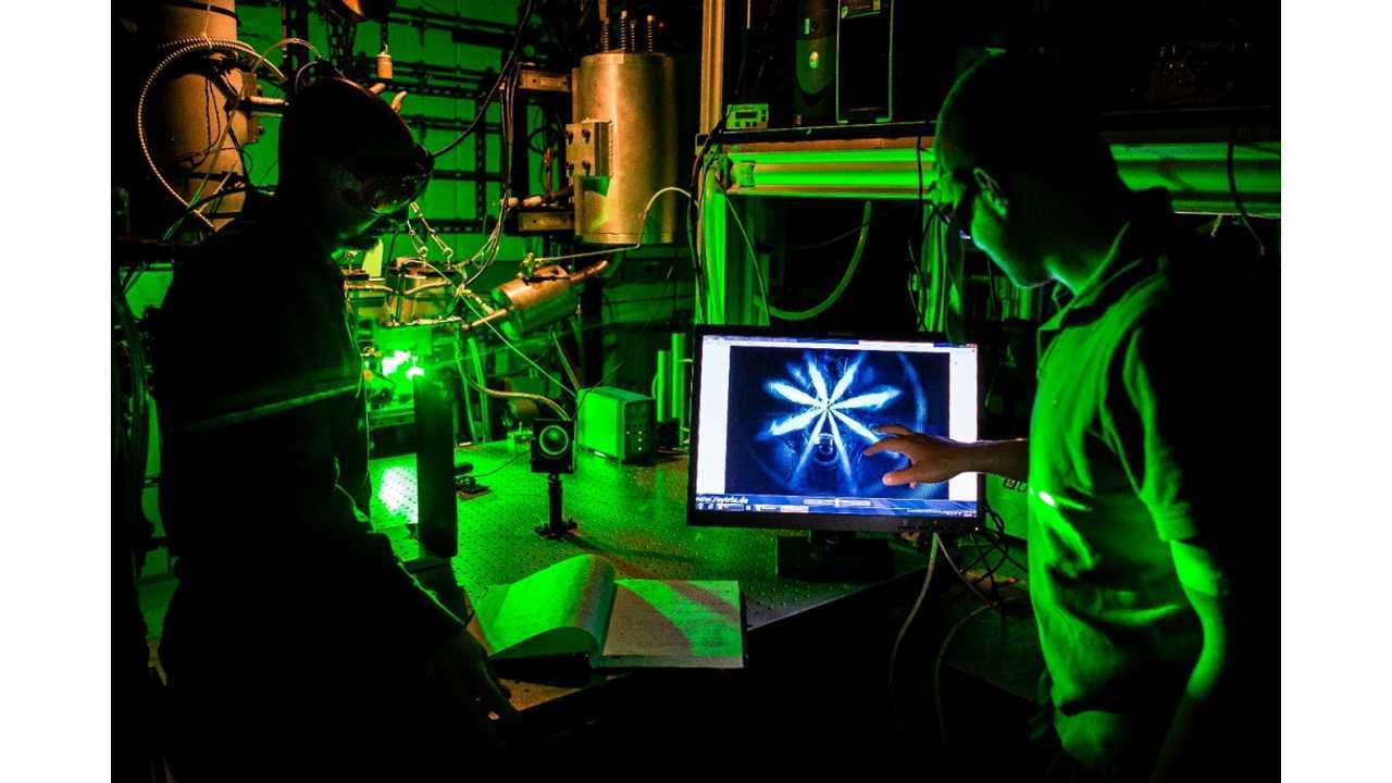 Peter Lillo and Philipp Schiffmann, ME PhD Students and researchers in Volker Sick's research group, examine an engine system in the Walter E. Lay Auto Laboratory on May 22, 2014. (photos: Joseph Xu, Michigan Engineering Communications & Marketing)
